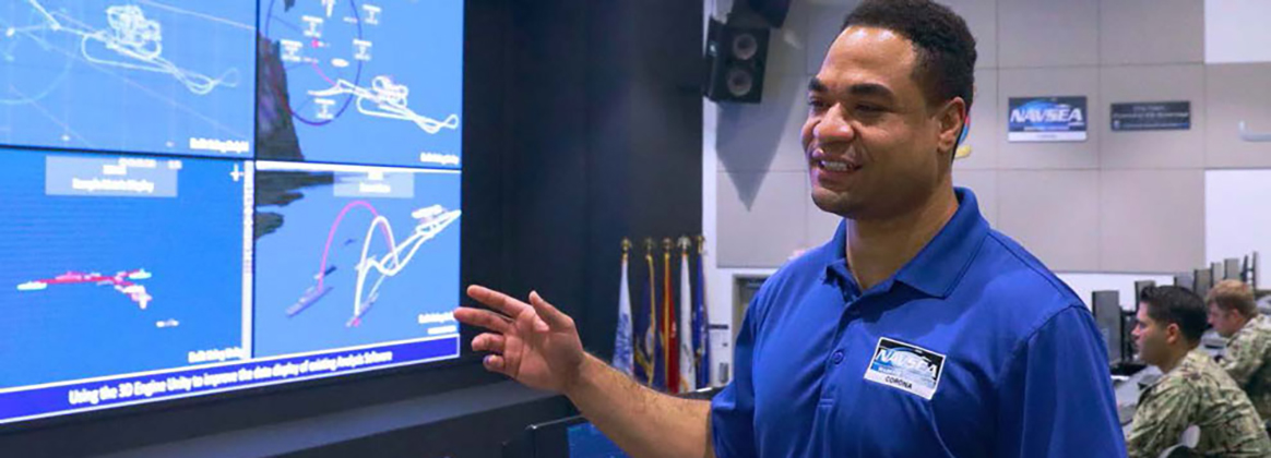 NSWC Corona’s Jason Grubb details the functionality of the Joint Warfare Assesment Lab(JWAL) Auditorium.